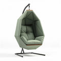 Hanging geometric chair in green fabric with metal base and cushion